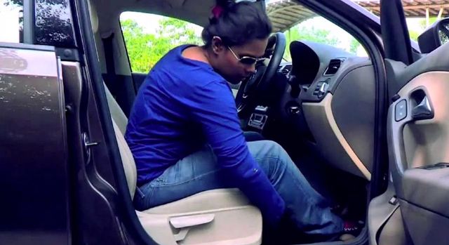 Woman adjusting a car seat