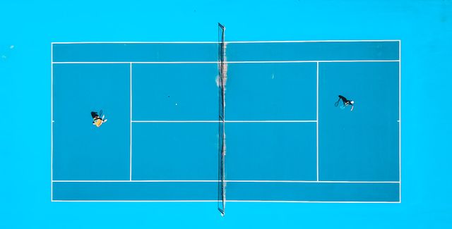 Top view of people playing tennis

