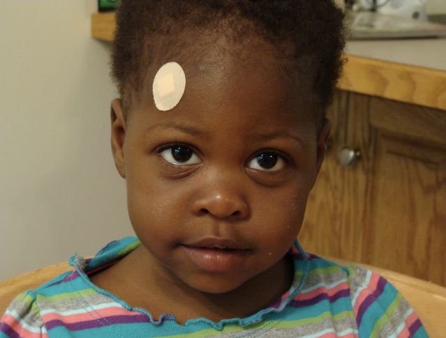 Girl with a 'skin color' bandaid significantly lighter than her skin
