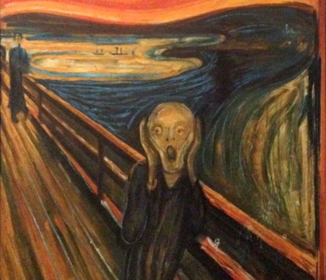 The Scream painting by Edvard Munch, man on a bridge with hands to his face screaming in colorful expressionist twisted style - behind him a couple walking, and boats in the distance.

