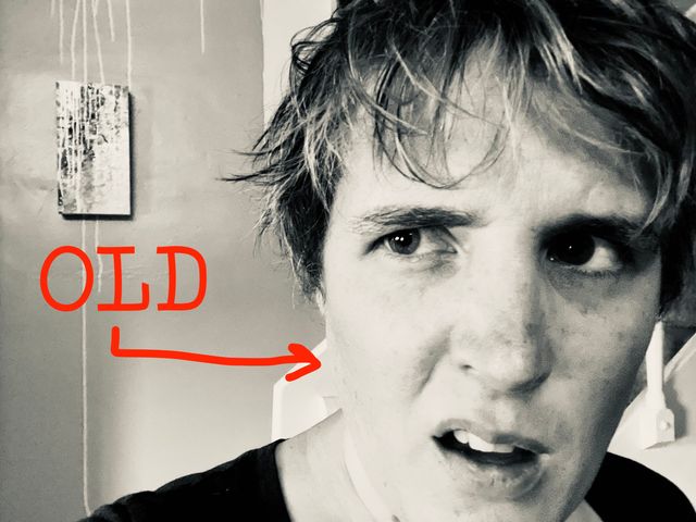 Miriam looking surprised and offended,
in black and white,
with the word OLD and an arrow
pointing at her face
