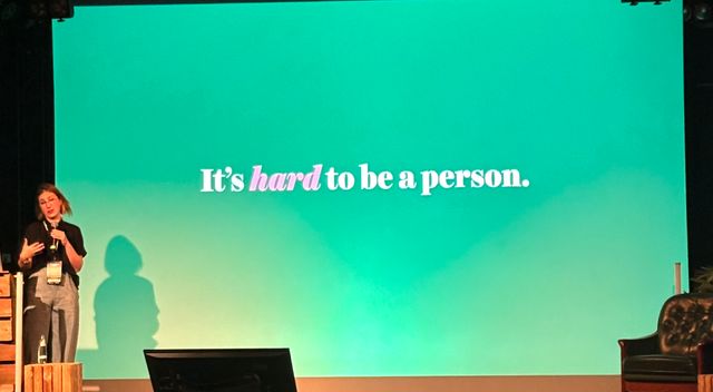 Jessica with a slide that says it's hard to be a person
