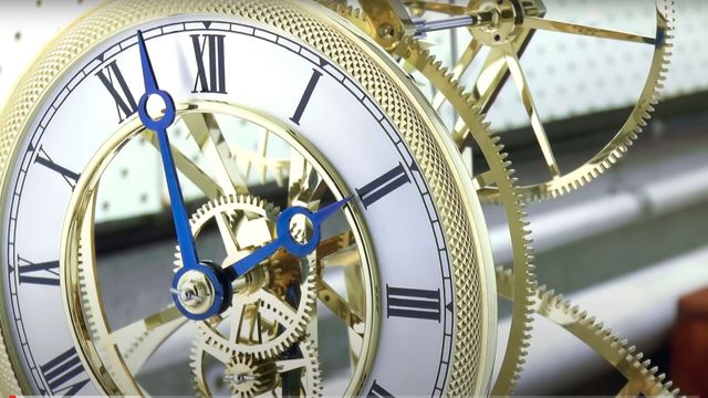 Closeup of skeleton clock with visible gears
